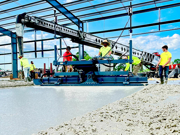 Close up of a construction crew doing concrete finishing with a Laser Screed. 