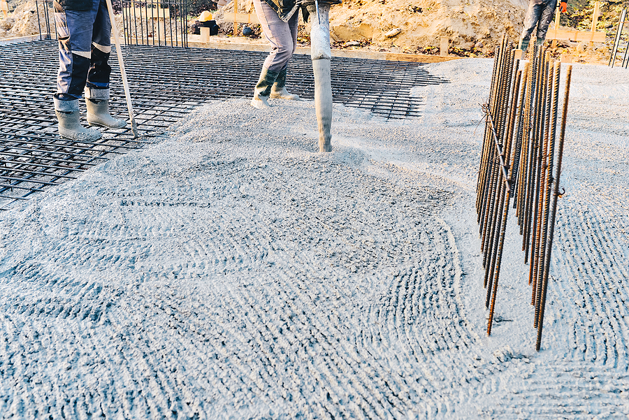 Concrete pouring at a commercial construction site. 